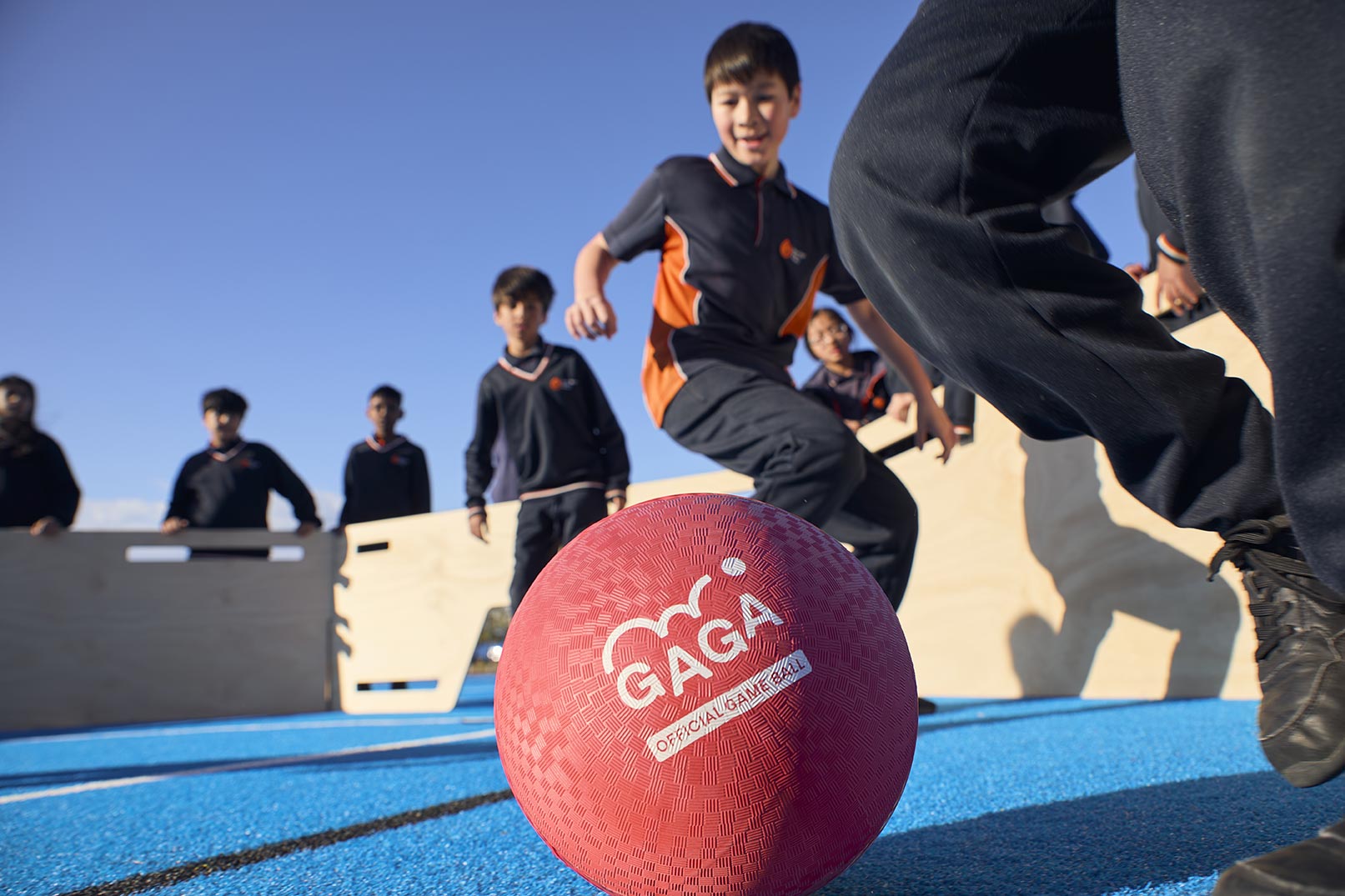 Official Gaga Playground Ball - Being played with by kids inside a Gaga Pit