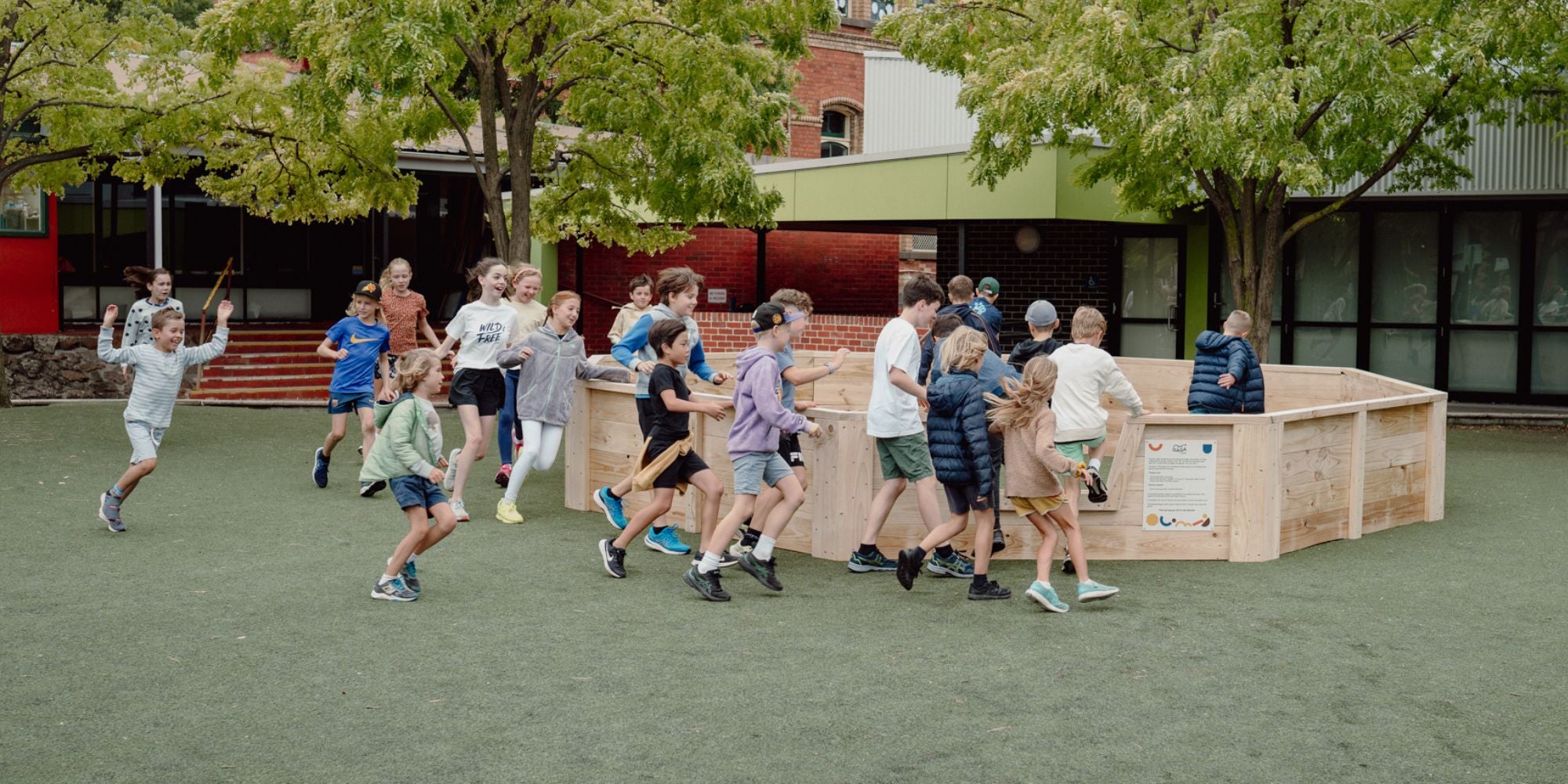 Kids running in to a Gaga Ball Pit installed at a Primary School in Victoria